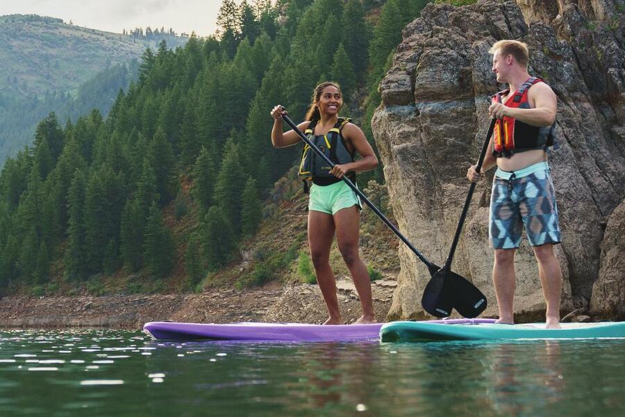 Outdoor retail customers enjoying paddleboards